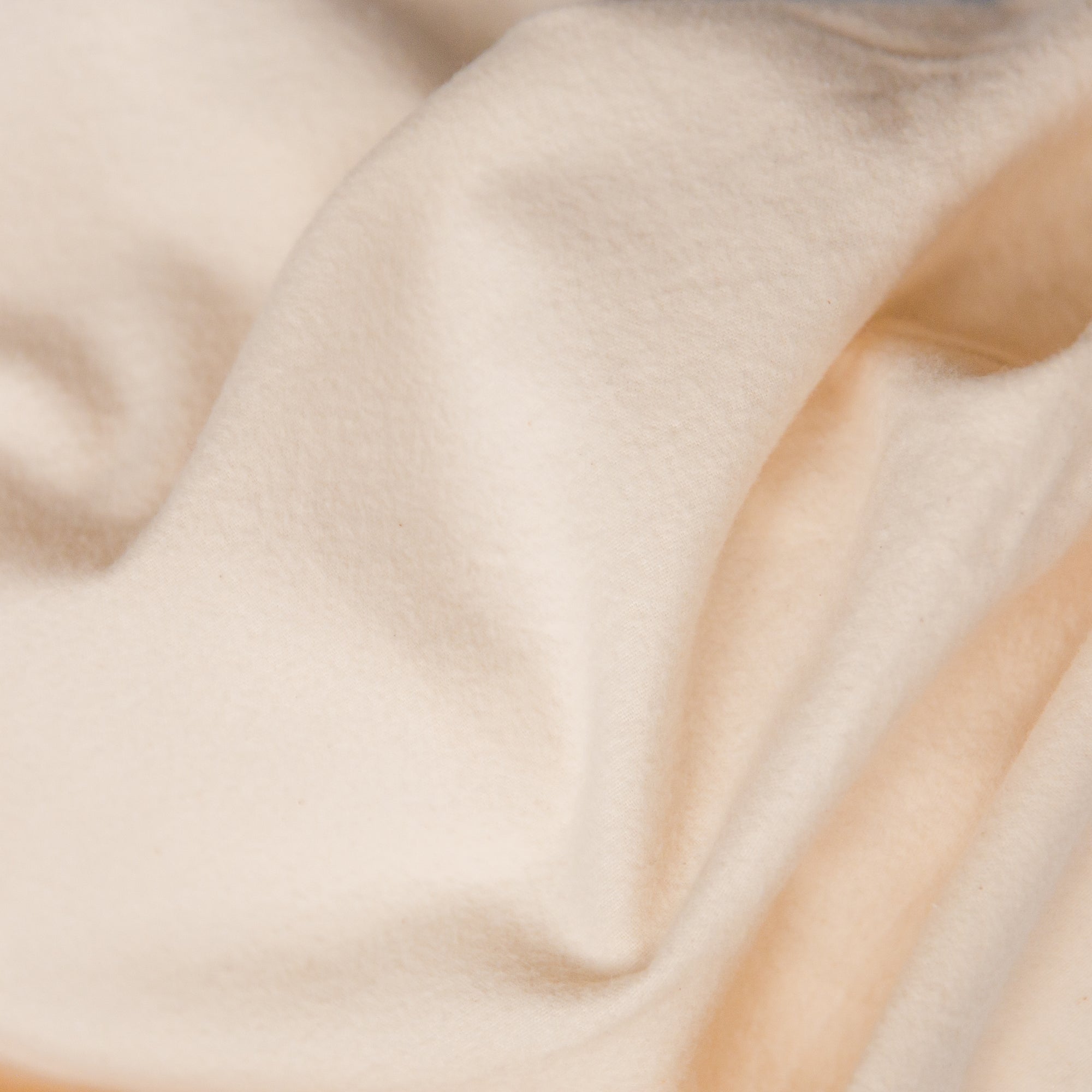 Detail view of soft, warm flannel fabric from an Oolie organic crib sheet.